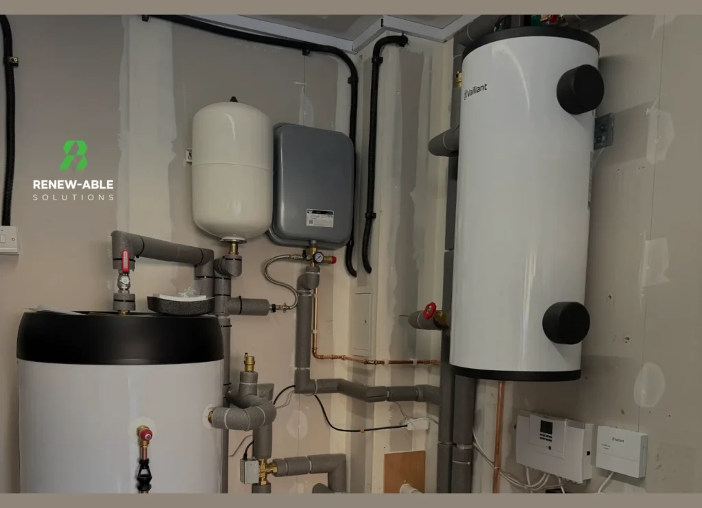 Vaillant cylinder, expansion vessels and insulated heating pipework in an indoor plant area