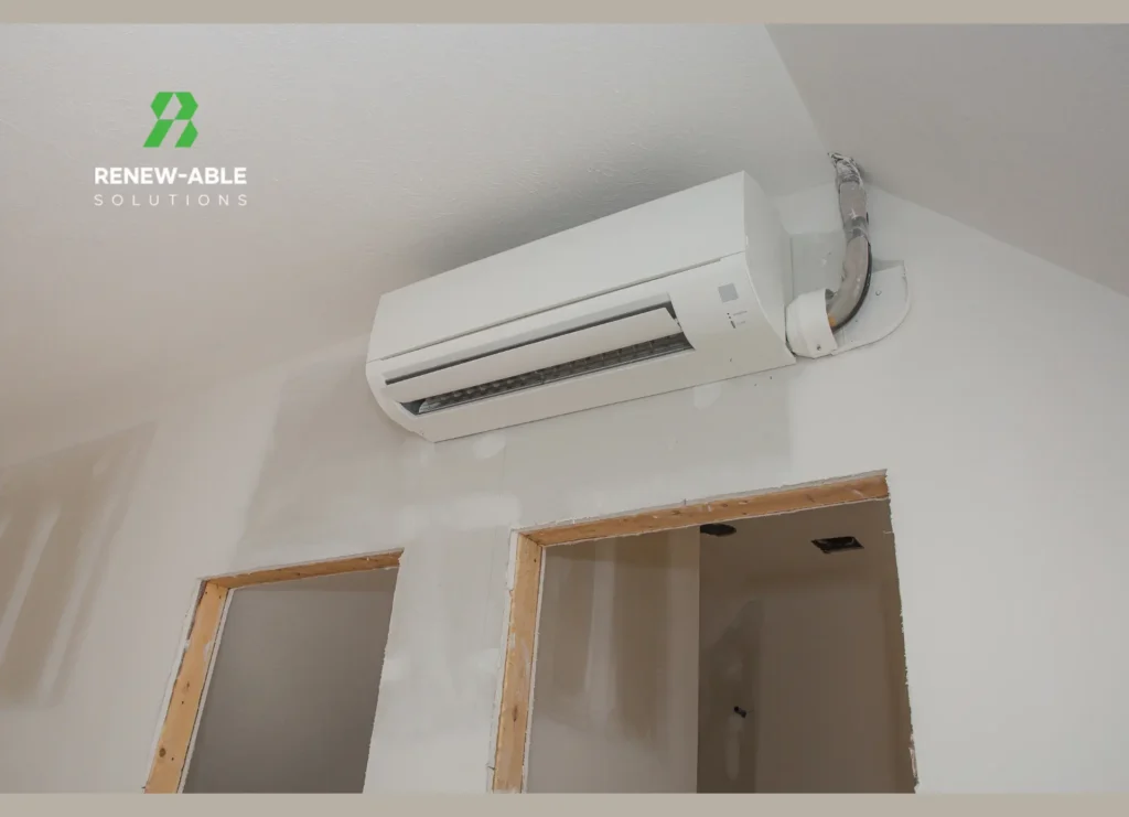 Wall-mounted air-to-air indoor unit above doorways during room refurbishment