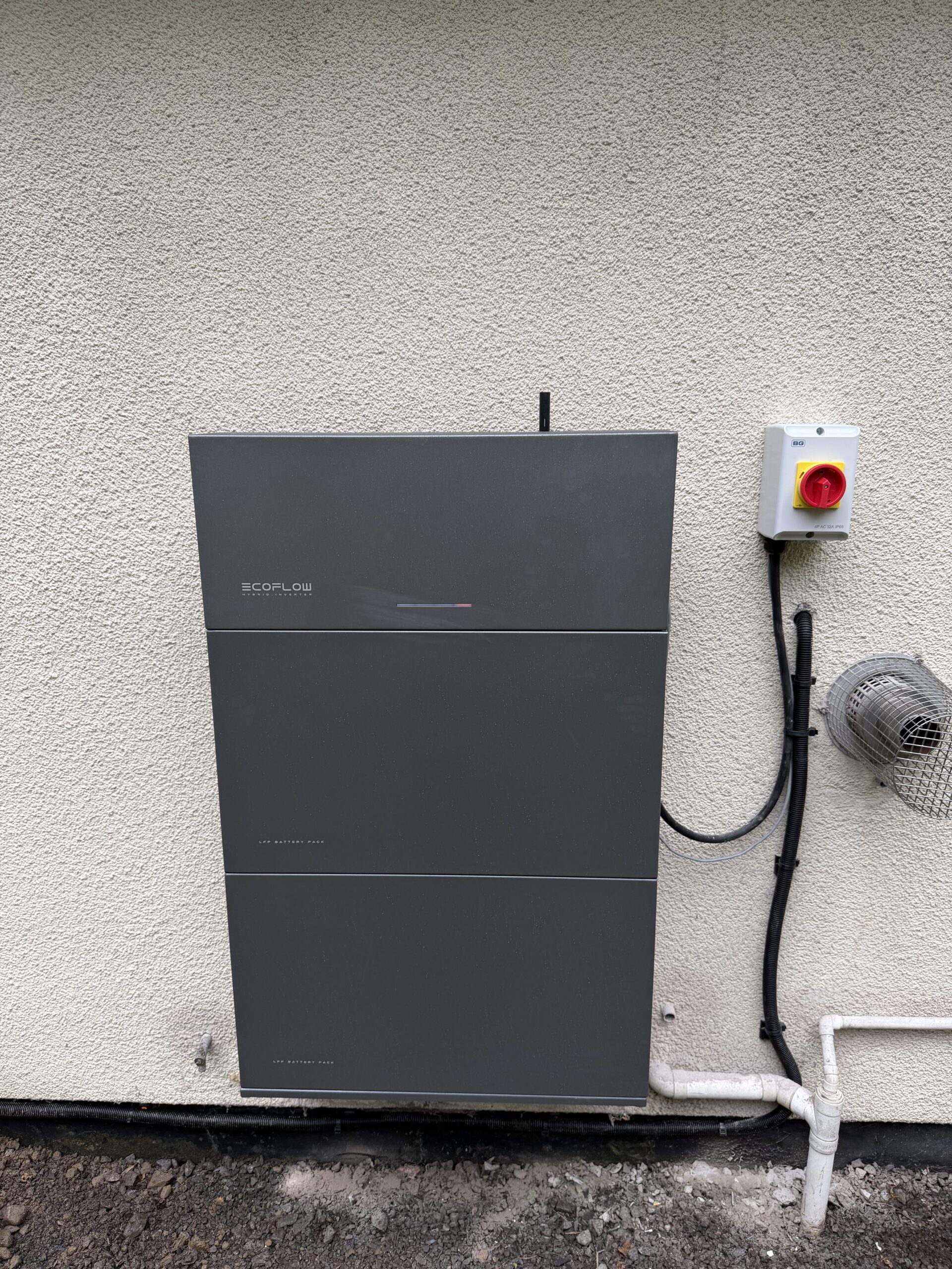 EcoFlow PowerOcean 5 kW hybrid inverter and two 5 kWh battery modules installed outdoors in Ballachulish near Glen Coe
