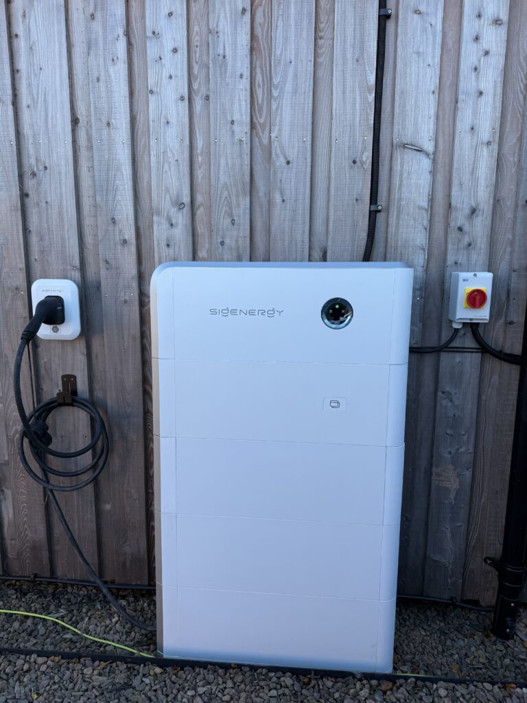 Sigenergy SigenStor system with DC EV charging cable and wall-mounted connector installed by Renew-Able Solutions