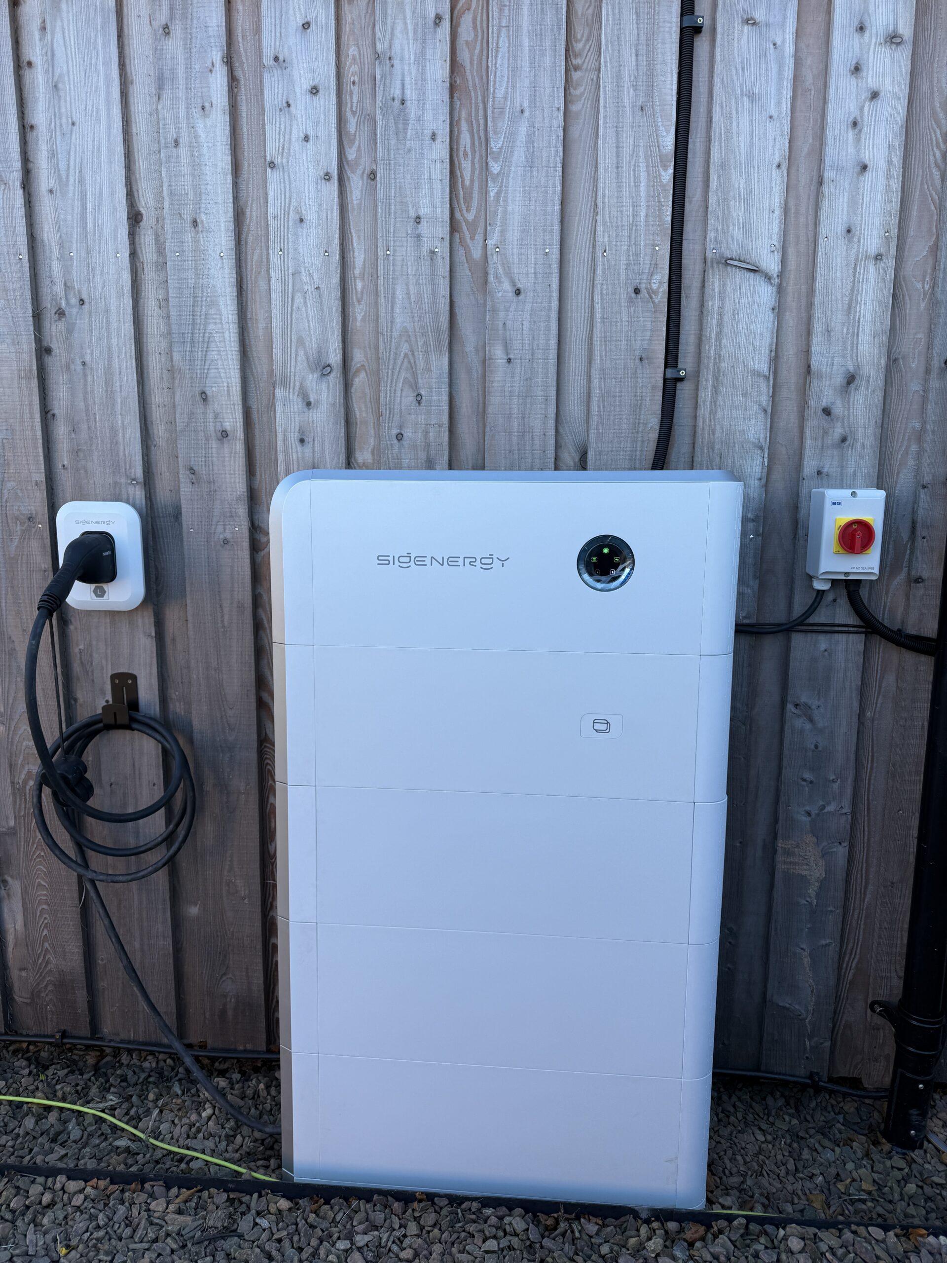Sigenergy system with integrated DC EV charging installed by Renew-Able Solutions beside a timber fence