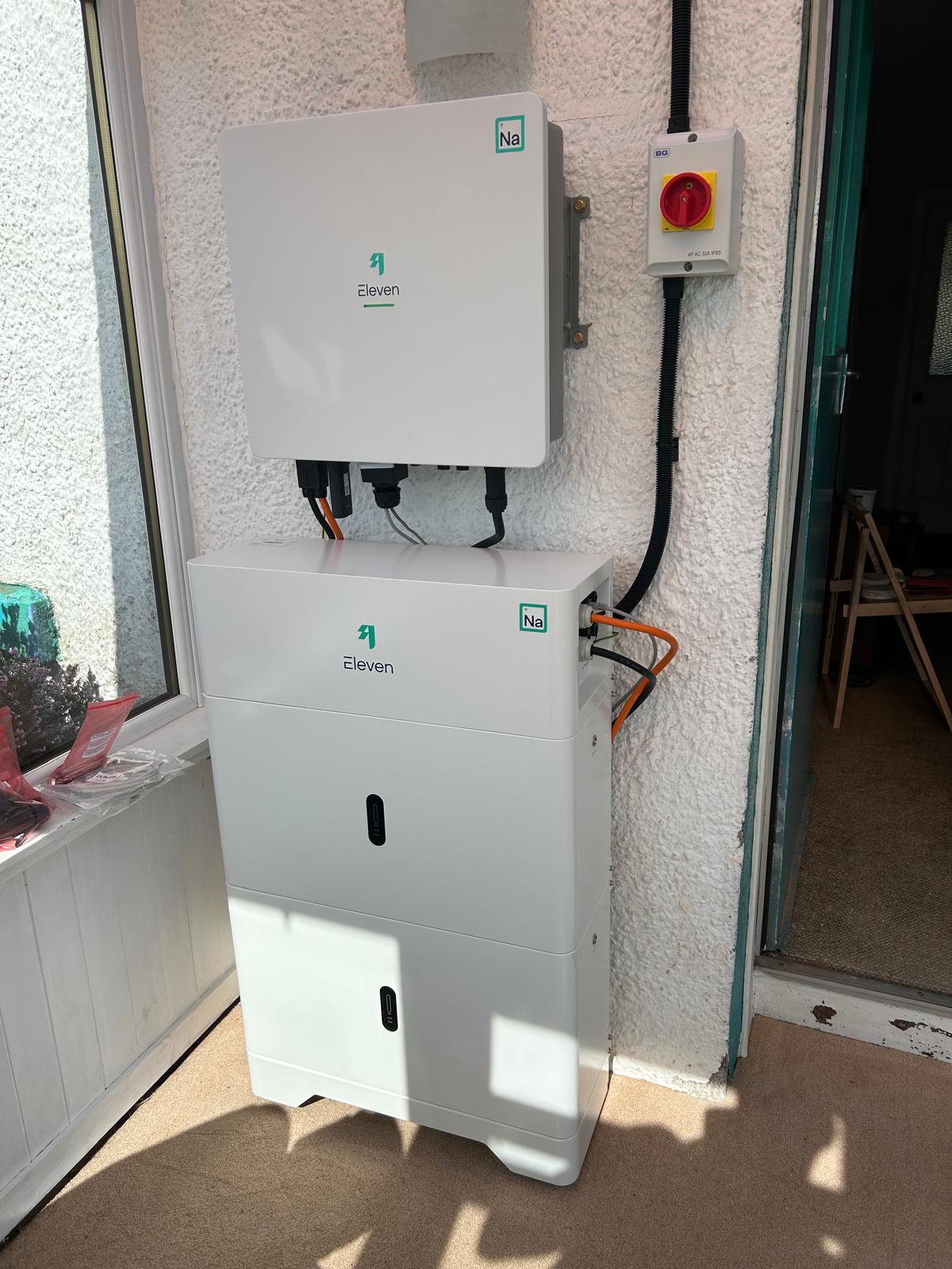 Angled view of two stacked Galvani sodium-ion battery modules beneath an Eleven Energy hybrid inverter