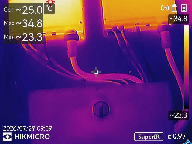Thermal image of solar inverter cable connections with recorded surface temperatures and a colour scale
