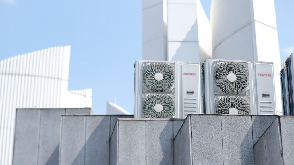 Commercial air conditioning outdoor units on a modern building rooftop