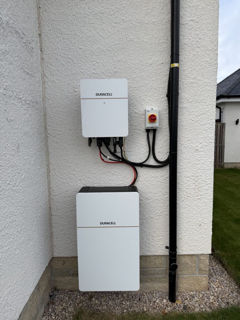 Duracell inverter and battery mounted on the exterior wall of a new-build home in Penicuik